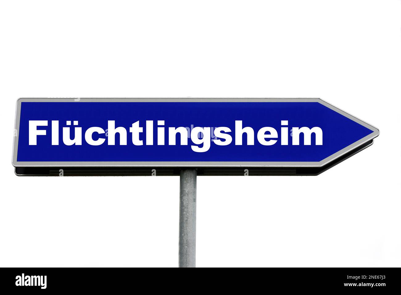 blue signpost lettering Fluechtlingsheim, refugee hostel Stock Photo