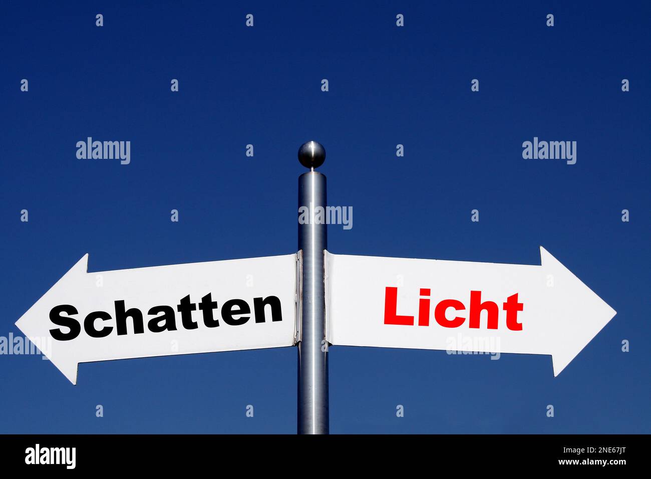 signposts pointing in different directions, options shadow - light Stock Photo