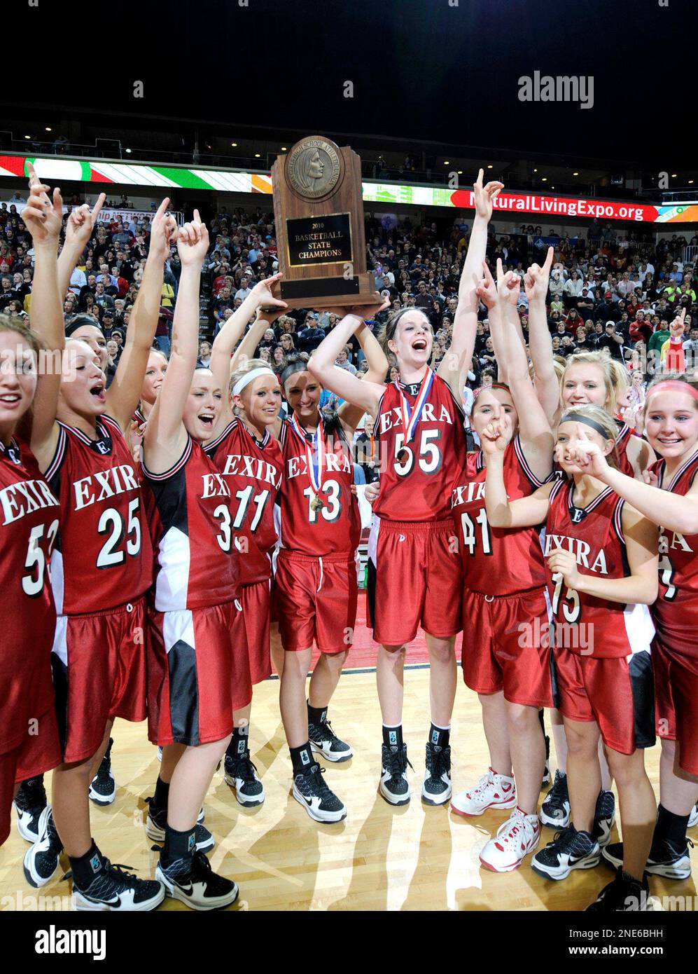 Exira team members hoist the trophy after defeating Mount Ayr in the