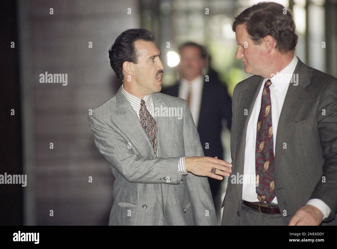 Theodore Briseno, left, and his attorney, Harland Braun, leave Federal  Court in Los Angeles, Thursday, April 9, 1993. Briseno and three other Los  Angeles police officers are on trial for violating the