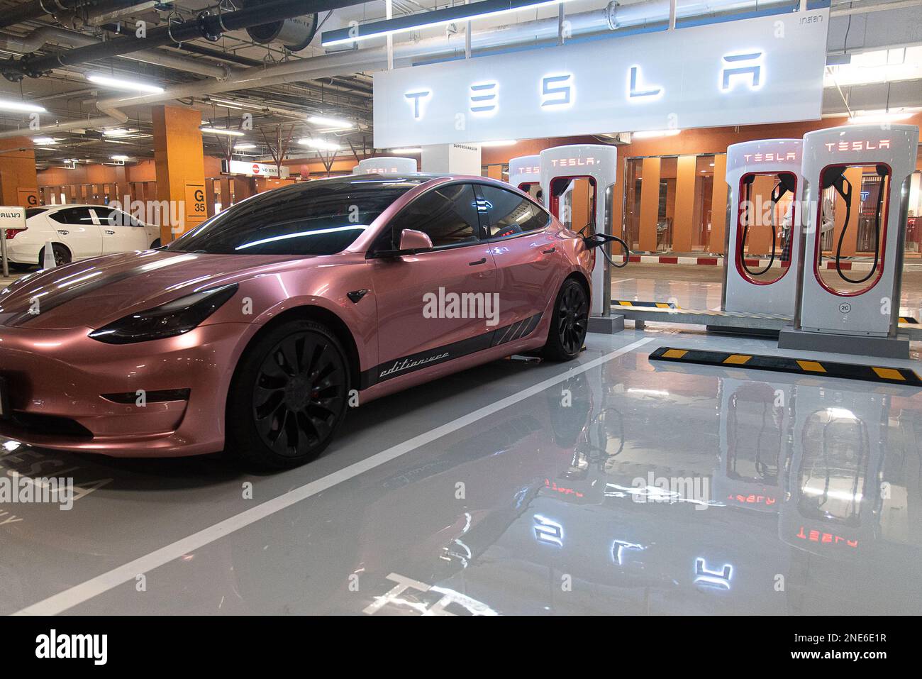 A Tesla car seen charging at the Tesla supercharger station at Central