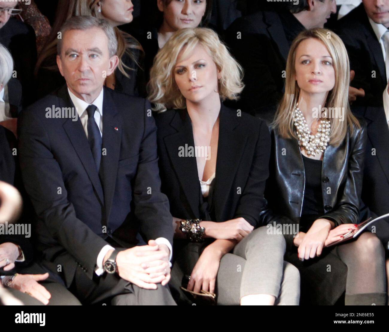 Bernard Arnault's daughter Delphine (R) and French fashion stylist Pierre  Cardin pose beside items on display after a press conference at the  occasion of Christian Dior's centenary at the headquarters of Christian