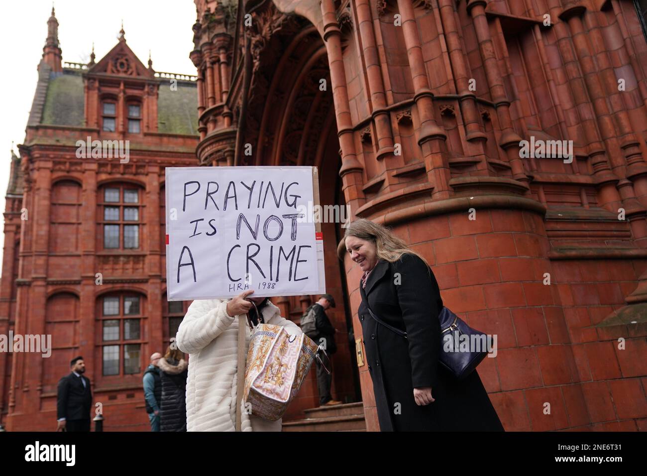 Supporters of Father Sean Gough, a Catholic priest of the Archdiocese of Birmingham, and Isabel Vaughan-Spruce, outside Birmingham Magistrates' Court where they are accused of protesting outside an abortion clinic inside a Birmingham abortion facility censorship zone. Picture date: Thursday February 16, 2023. Stock Photo