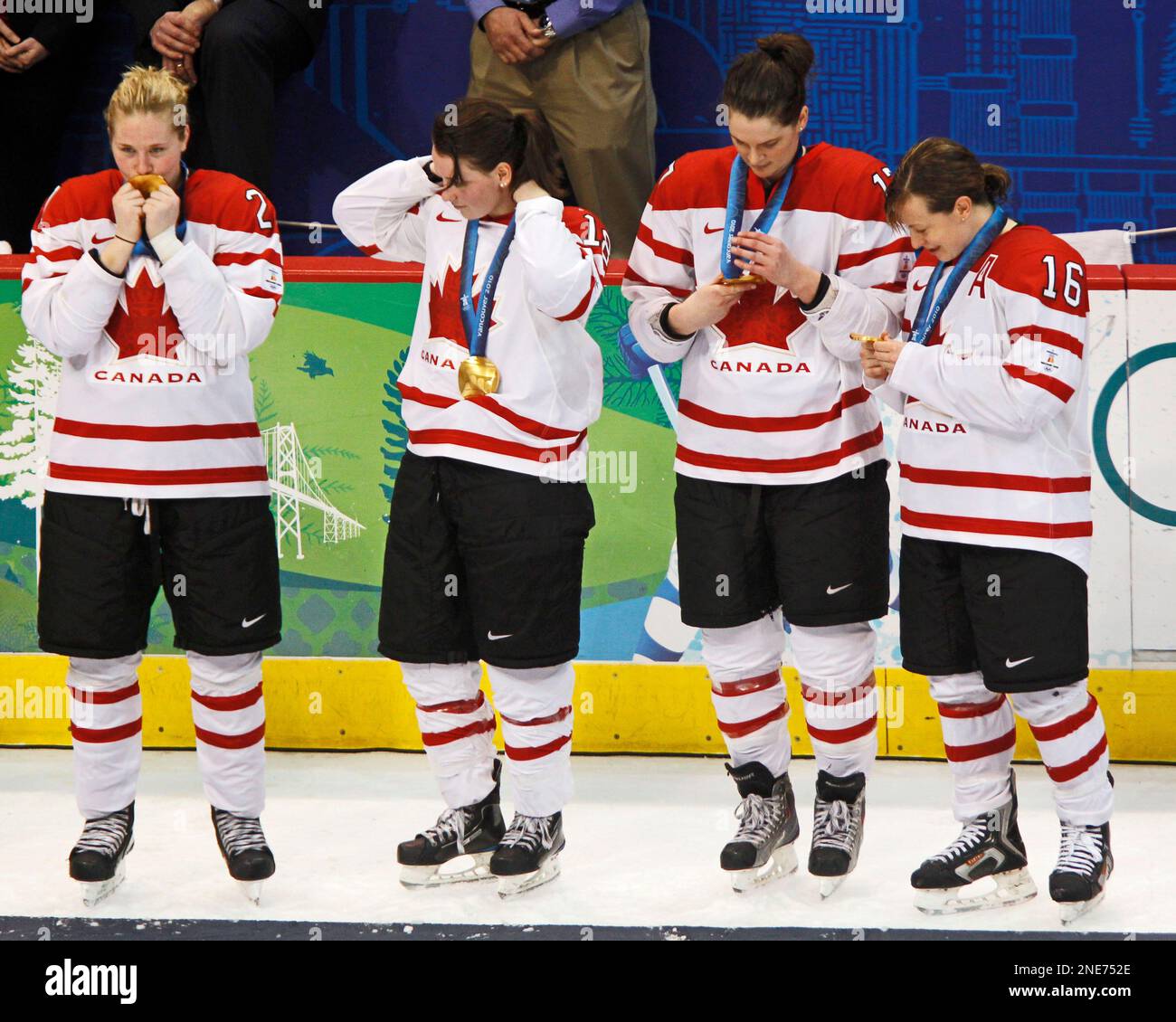 Team Canada's Jayna Hefford ,16, Catherine Ward , 18, and teammates