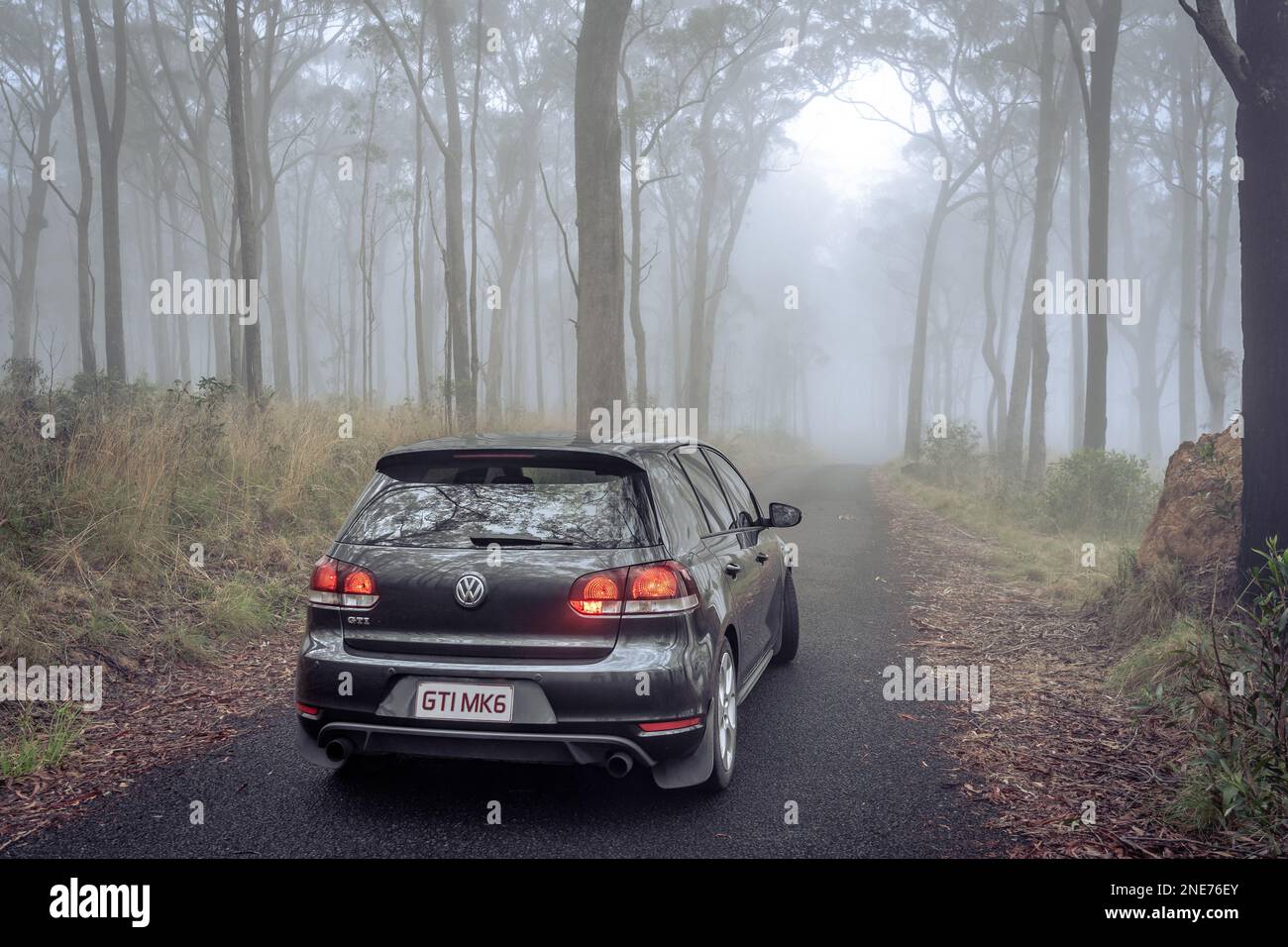 New South Whales, Australia - Volkswagen Golf GTI MKVI parked in a foggy forest Stock Photo