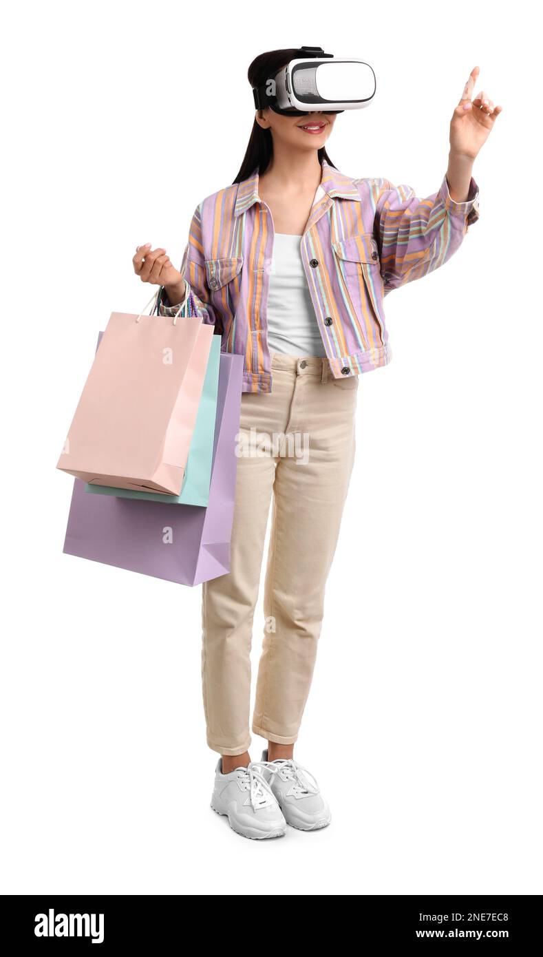Woman using virtual reality headset on white background Stock Photo - Alamy
