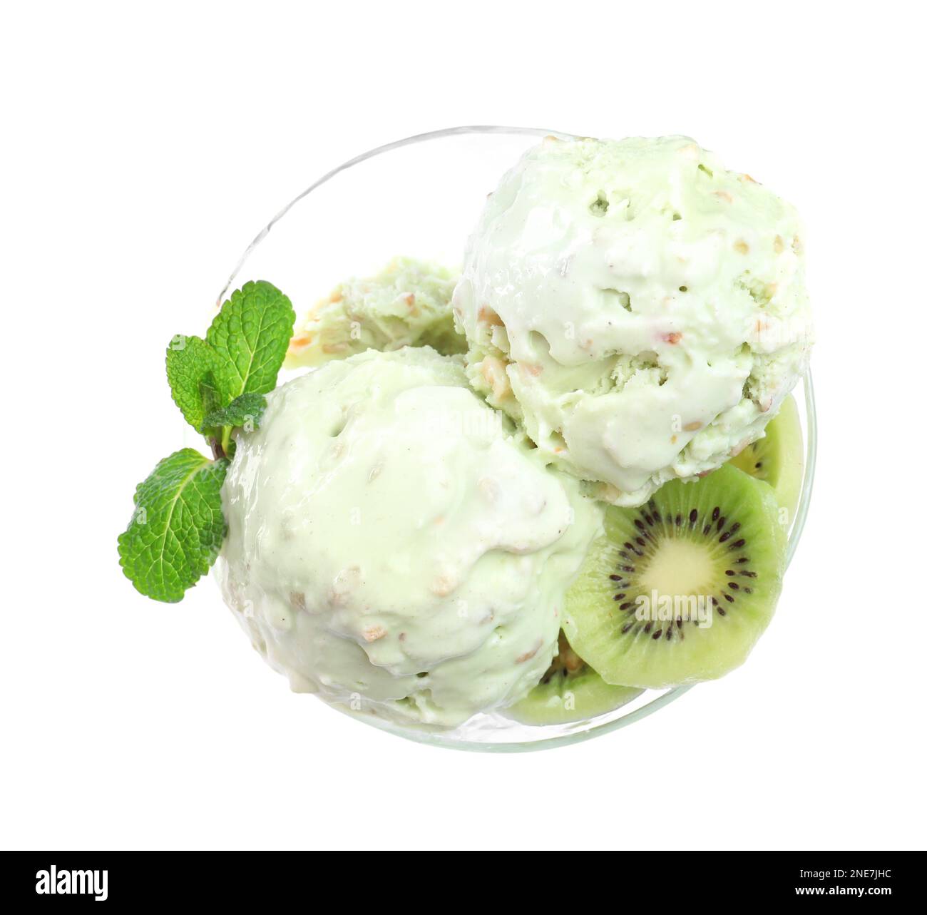 Delicious green ice cream with mint and kiwi in glass dessert bowl ...