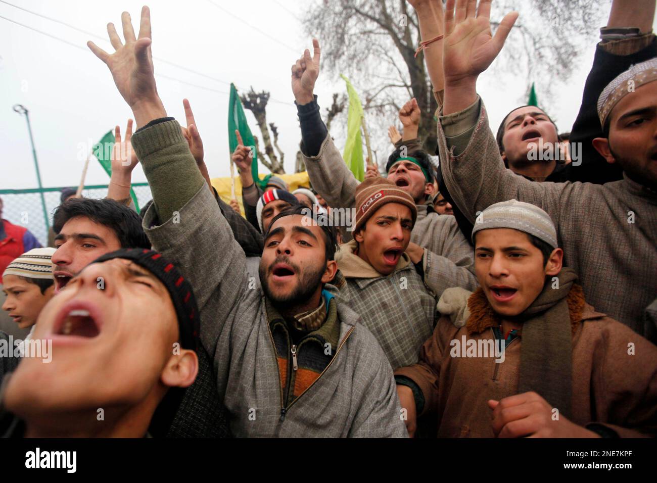 Kashmiri Muslims shout Islamic slogans during a procession to ...