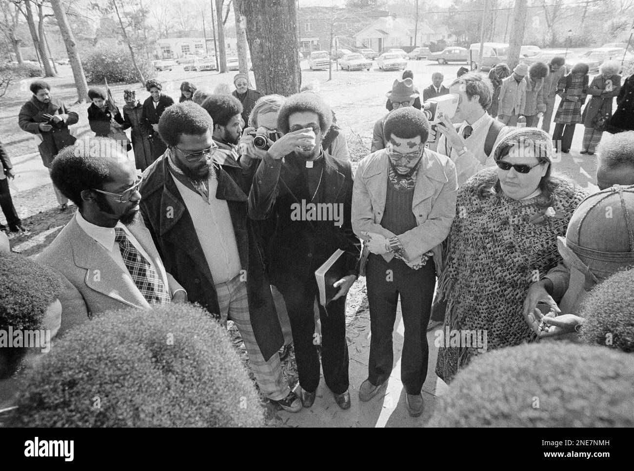 Members of the ?Wilmington 10? hold a brief communion service before