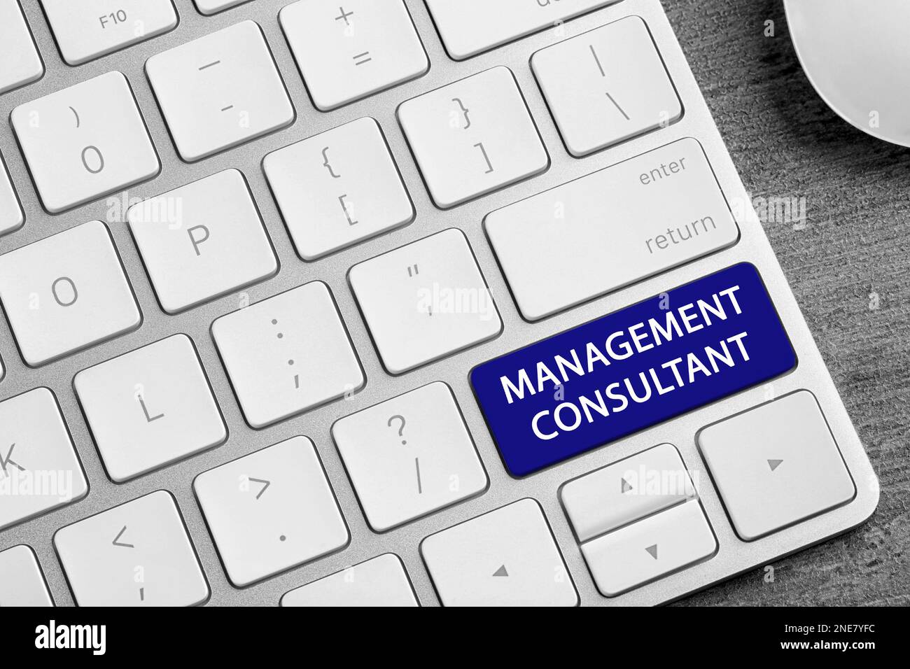 Button with text MANAGEMENT CONSULTANT on keyboard, closeup Stock Photo