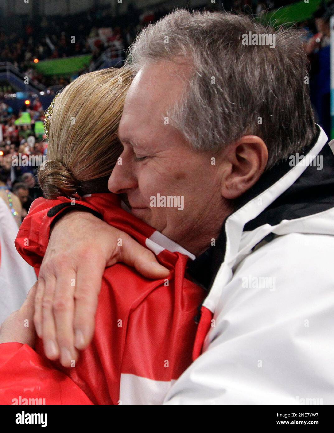 Canada's Joannie Rochette gets a hug from her dad Normand Rochette ...