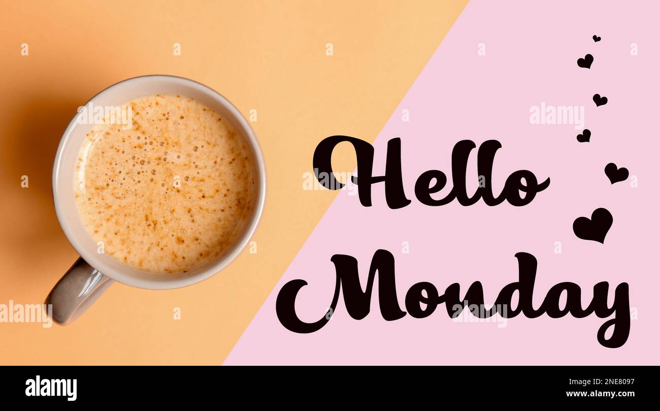Cup of hot aromatic coffee and phrase Hello Monday on color background