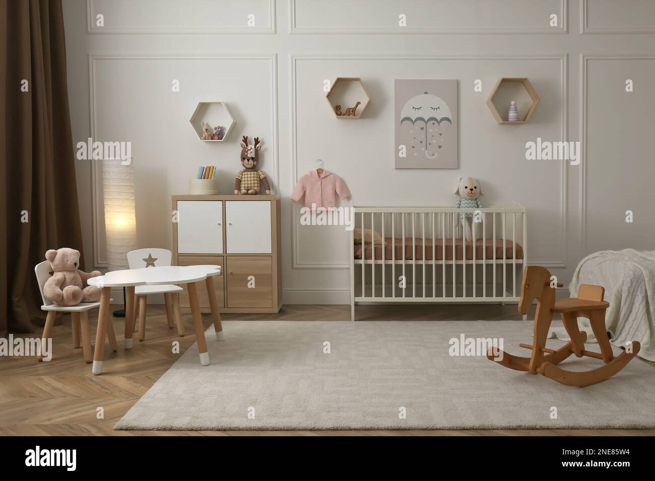 Modern baby room interior with stylish furniture and toys Stock Photo ...