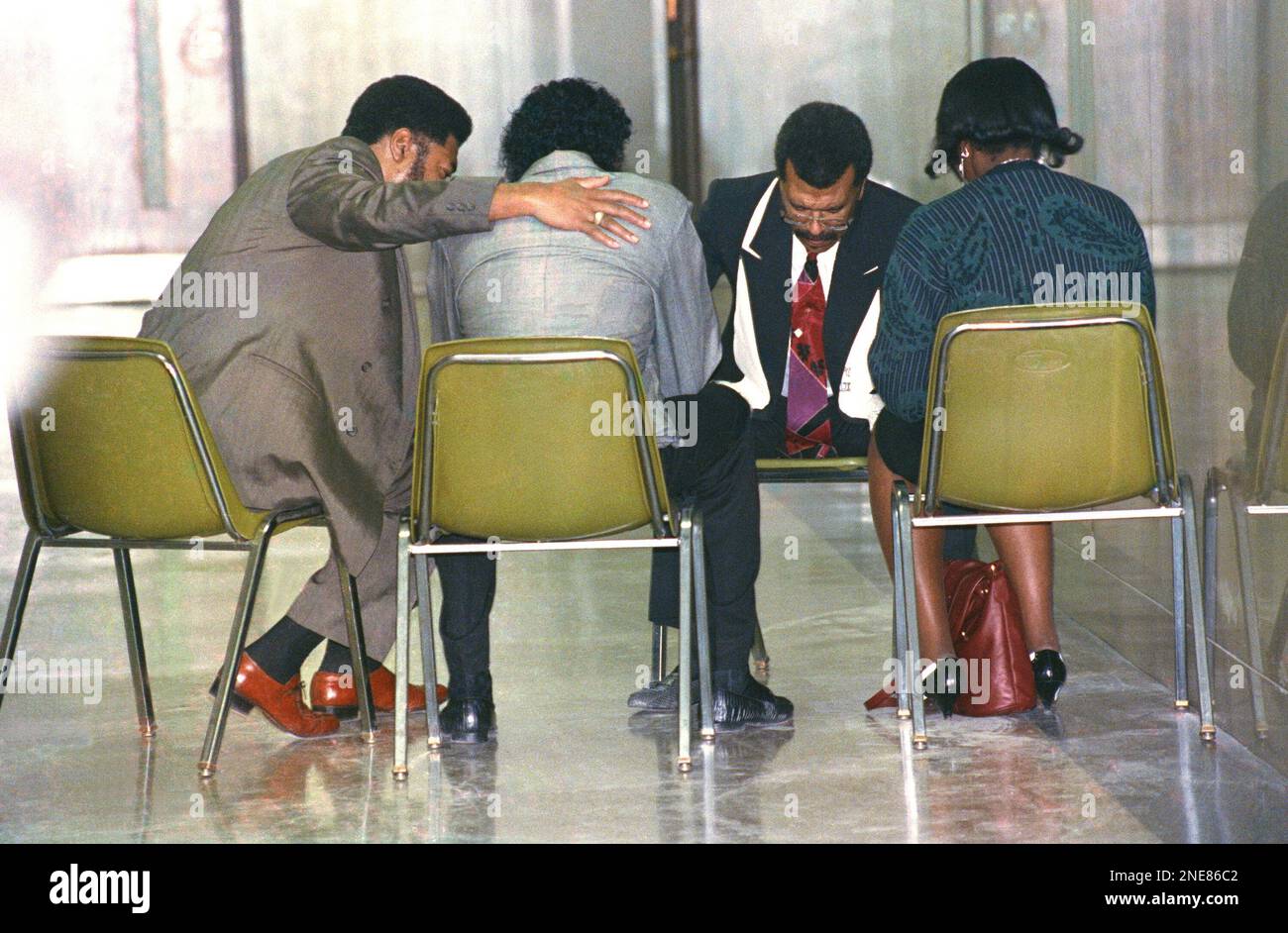 Elder Durain Hughes, left consoles Leonard Sargeant as Rev. Gene