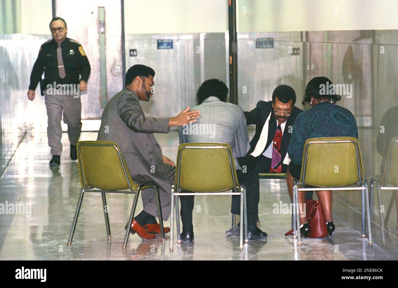 As a Milwaukee County sheriff's deputy patrols the hallway, Elder