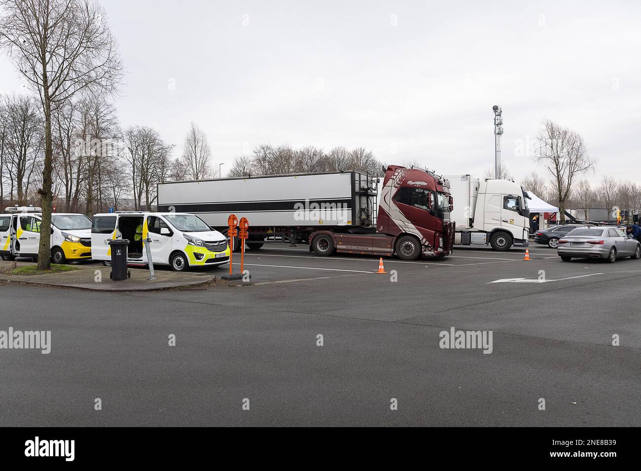 Illustration picture shows a major control action 'Albatross' by the police, customs and inspection services on the E40 highway in Wetteren, Thursday 16 February 2023. Federal and local police services, customs, various inspection services and a delegation of inspectors from the Netherlands and Denmark will today check trucks and buses at the motorway parking areas along the E40 in Wetteren. Coordinated by the East Flanders Road Police, under the watchful eye of the public prosecutor's office and labor auditor of East Flanders, they will check on various aspects of heavy transport: the tachogr Stock Photo
