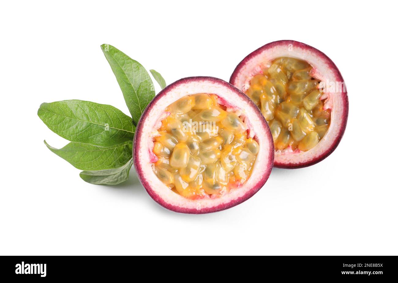 Cut ripe passion fruit with leaf isolated on white Stock Photo - Alamy