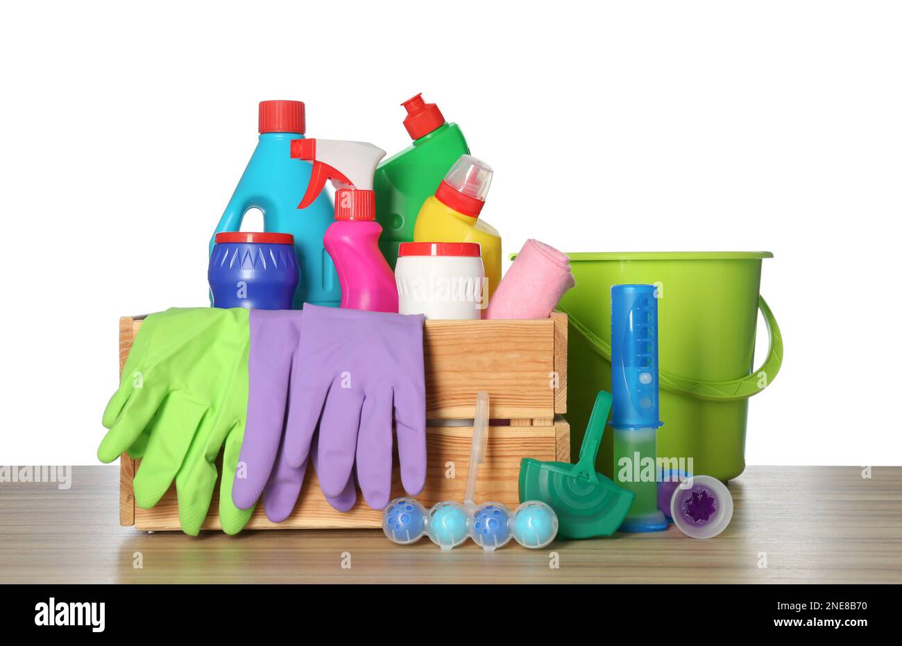 https://c8.alamy.com/comp/2NE8B70/different-toilet-cleaning-tools-and-crate-on-wooden-table-against-white-background-2NE8B70.jpg