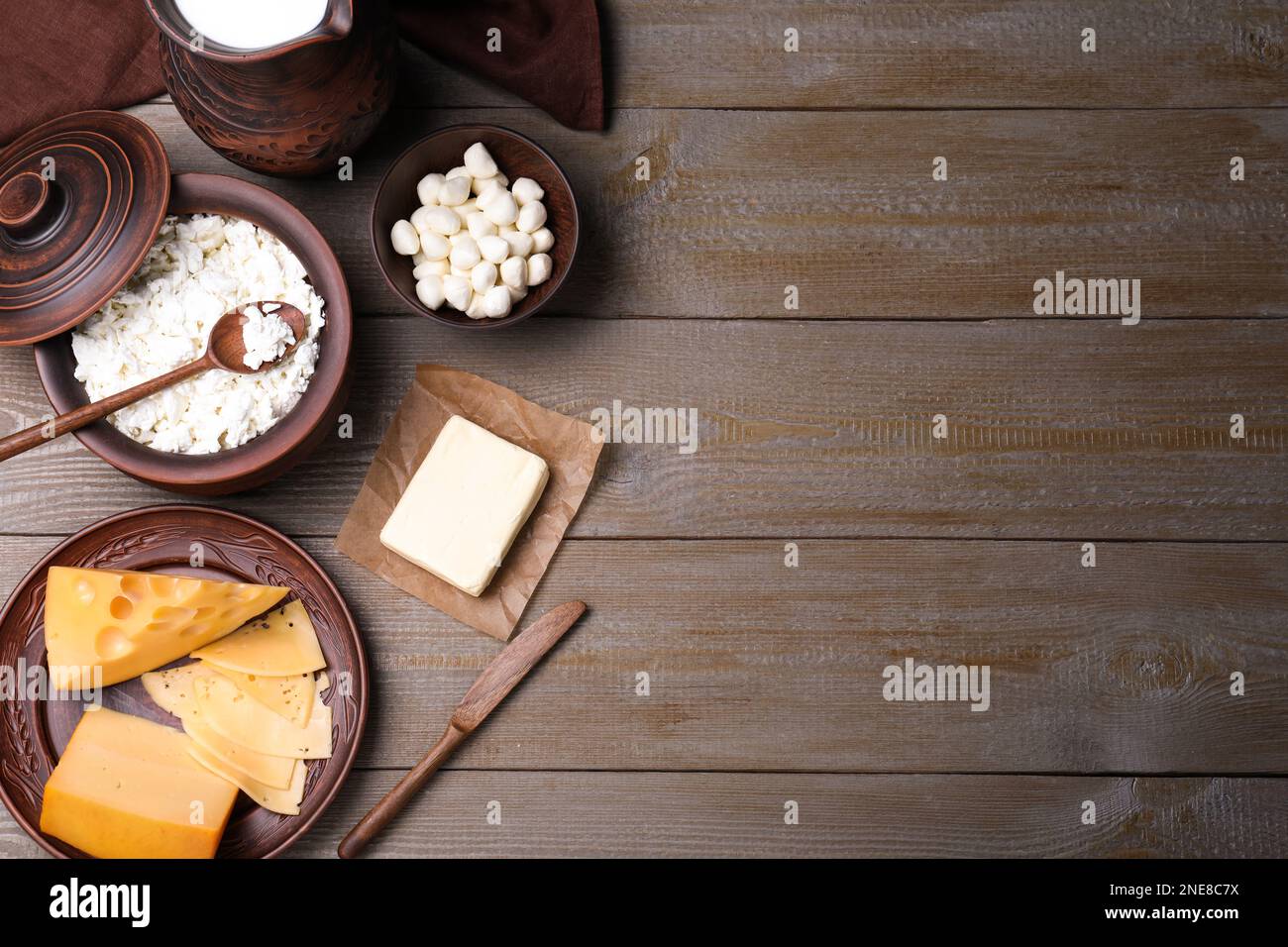 Flat lay composition with dairy products and clay dishware on grey ...