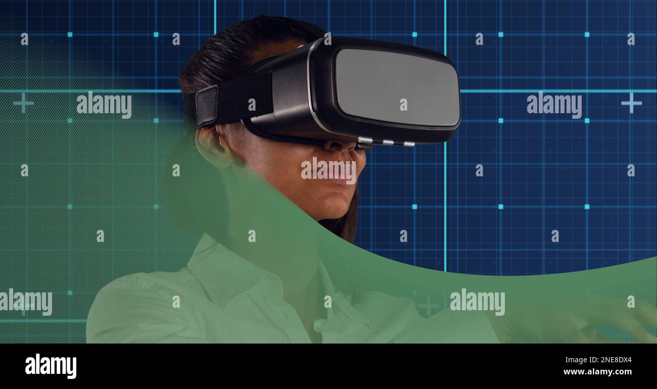 Businesswoman wearing vr headset over grid network against green technology background Stock Photo