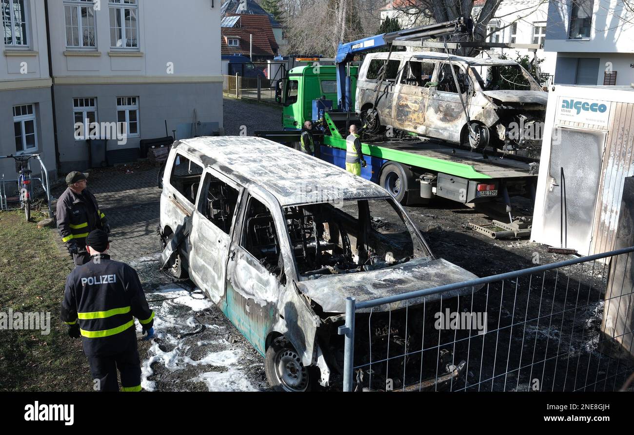 Leipzig, Germany. 16th Feb, 2023. Burned-out vehicles from the state-owned enterprise Sachsenforst are secured by the police. Two vans and two cars were apparently deliberately set on fire by unknown persons at the depot in the Connewitz district. The police suspect a political background. Credit: Sebastian Willnow/dpa/Alamy Live News Stock Photo
