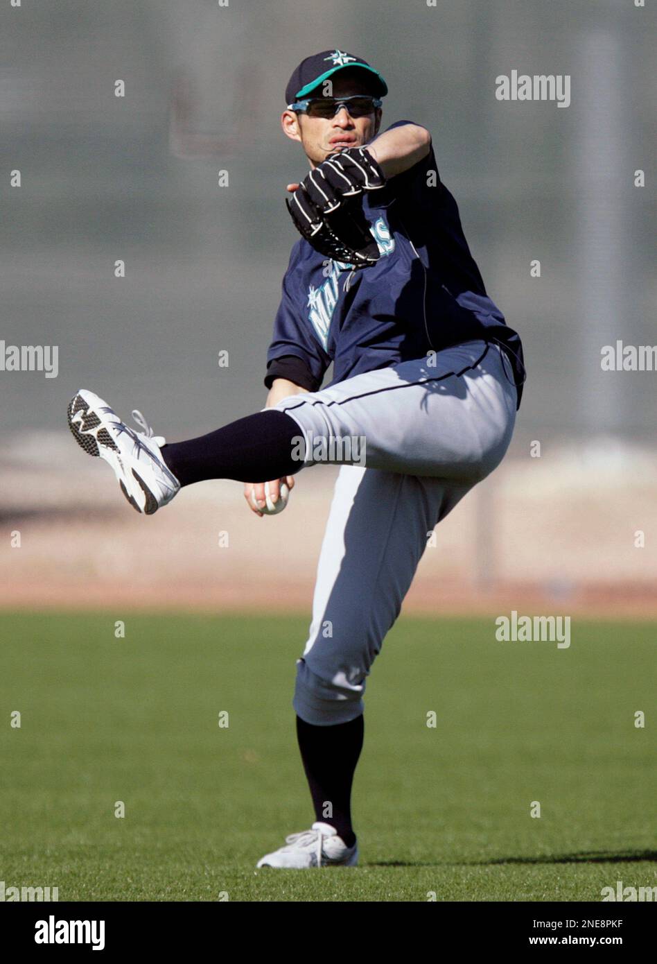 Ichiro Rookie Spring Training Seattle Mariners outfielder Ichiro Suzuki, of Japan, winds up to throw ...
