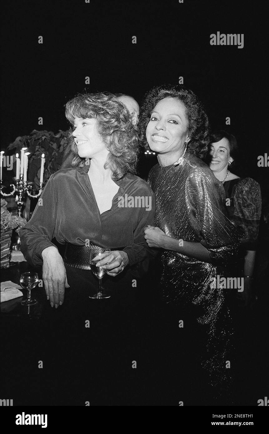 Actress Jane Fonda, left, and Diana Ross carry on animated conversation