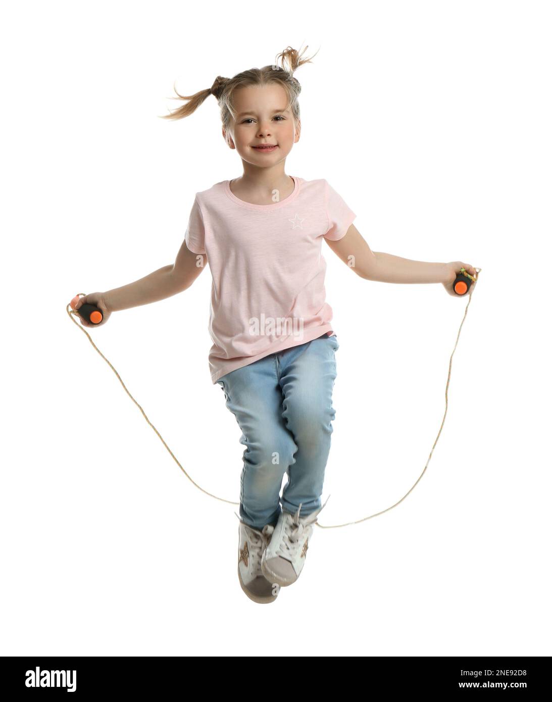 Cute little girl with jump rope on white background Stock Photo - Alamy