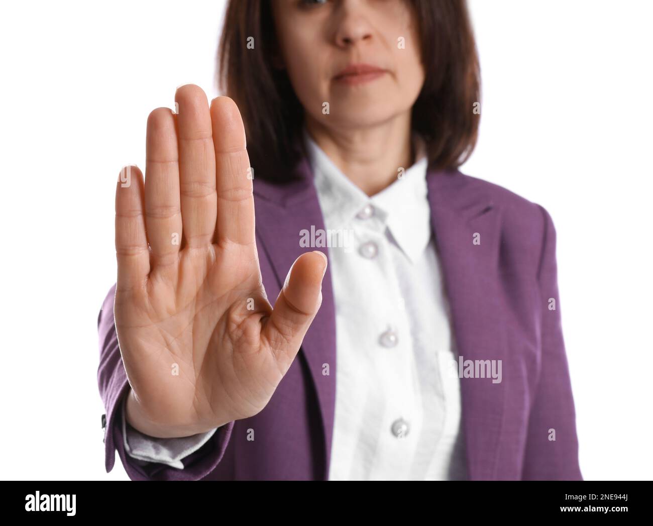 Mature woman showing stop sign hi-res stock photography and images - Alamy