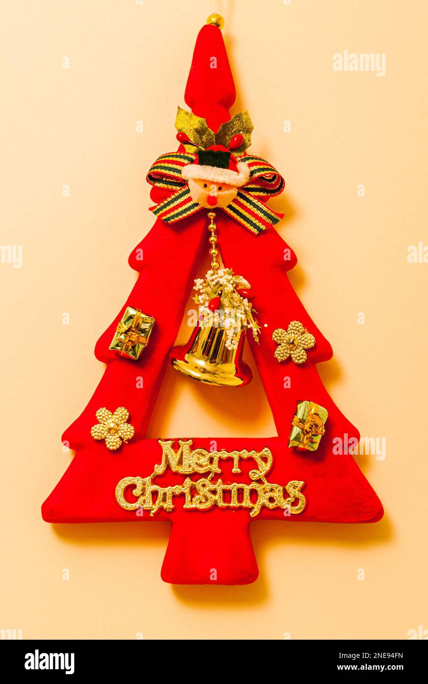 Red and gold Christmas tree shaped decoration. Stock Photo