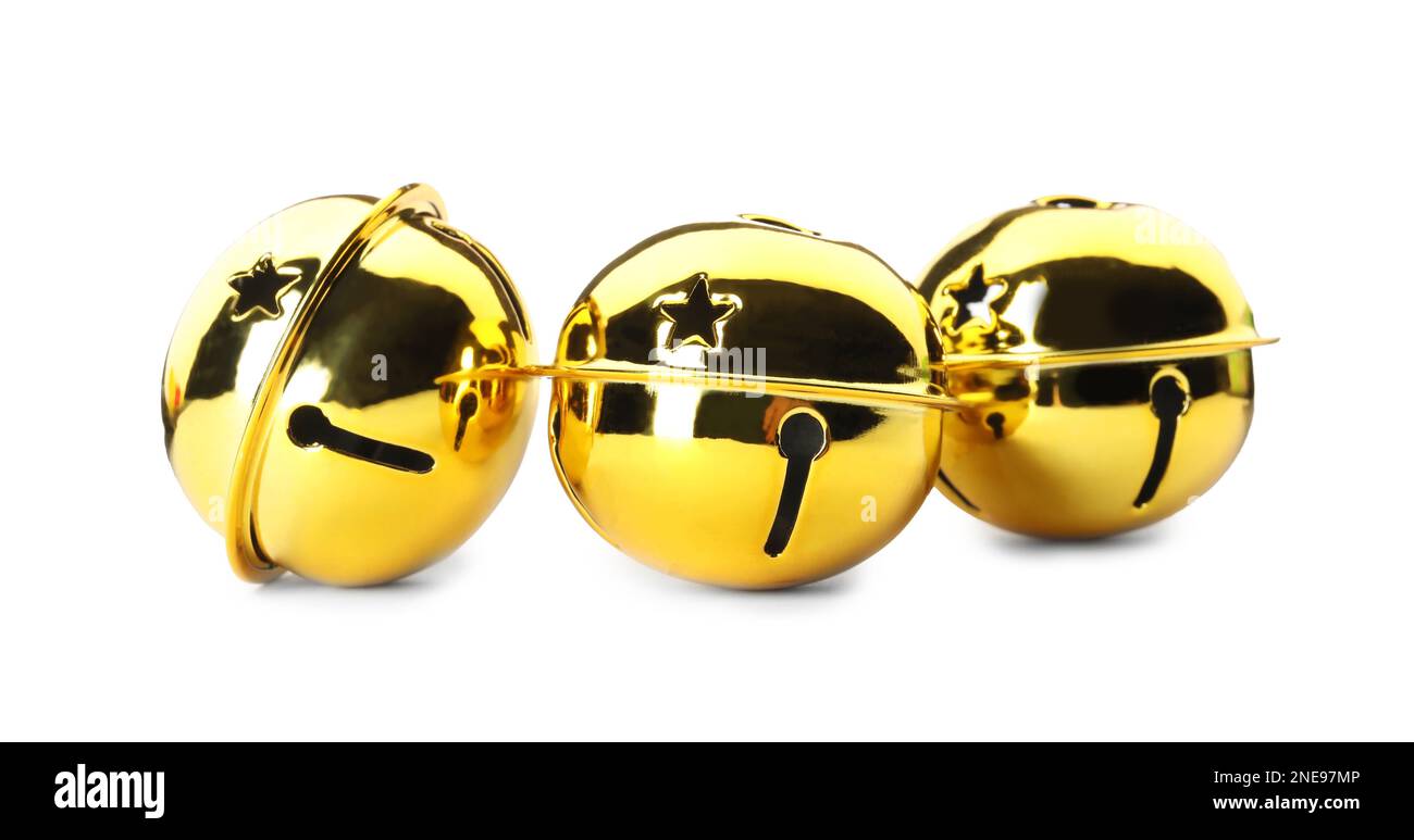 Shiny golden sleigh bells on white background Stock Photo - Alamy