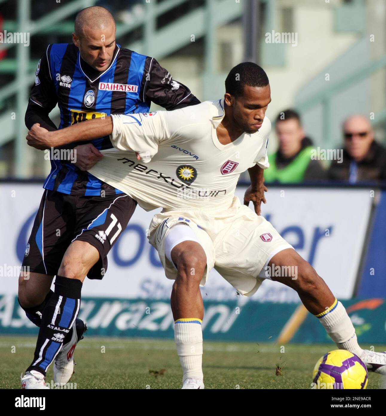 Atalanta's Paolo Bianco, left, gets to grips with Chievo's Marcos Ariel