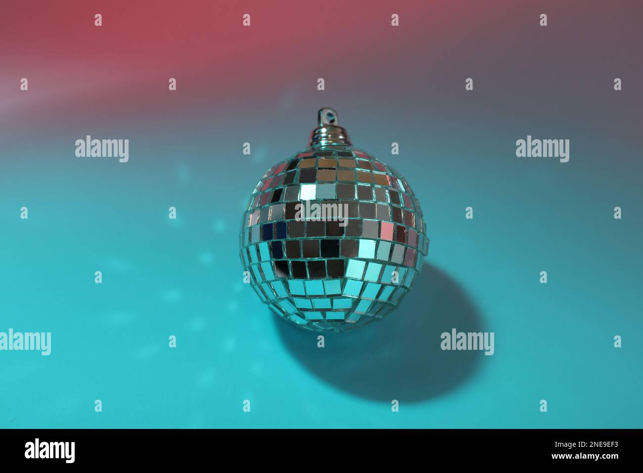 Bright shiny disco ball on color background Stock Photo Alamy