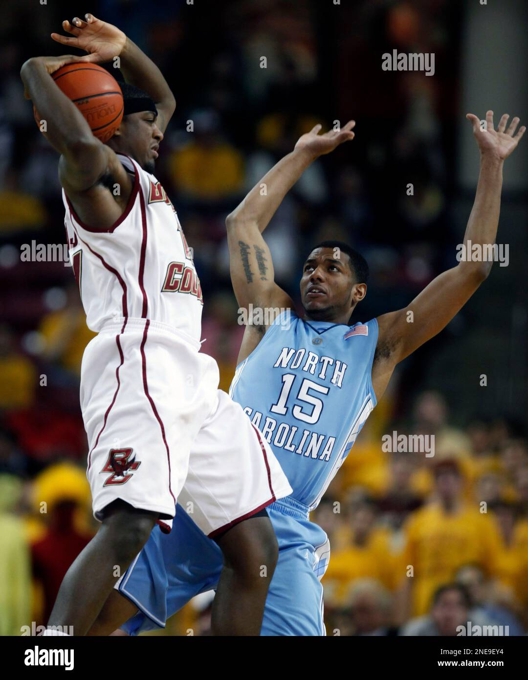 Boston College's Corey Raji, left, tries to get control of the rebound