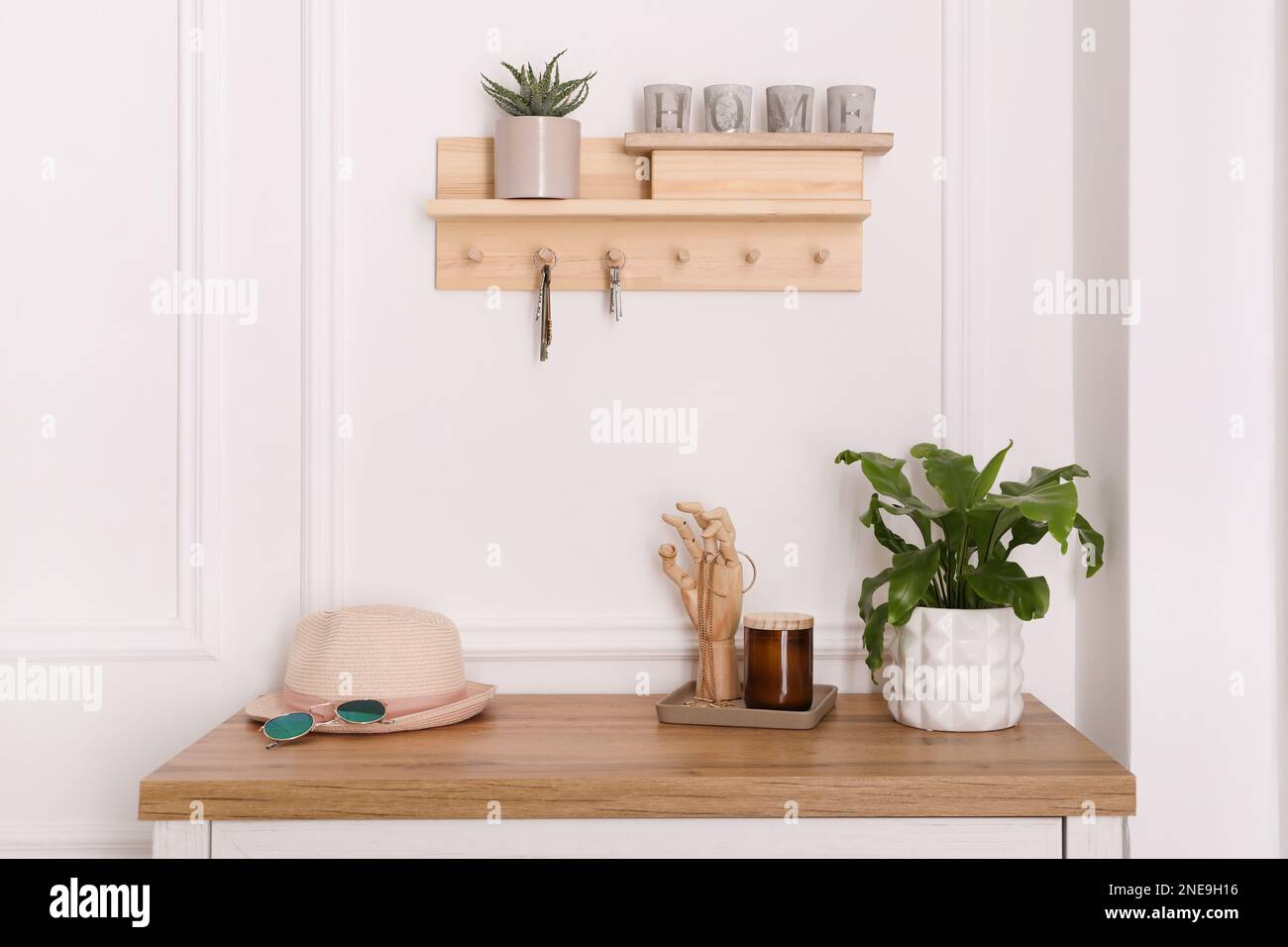 Wooden hanger for keys on white wall in hallway Stock Photo Alamy