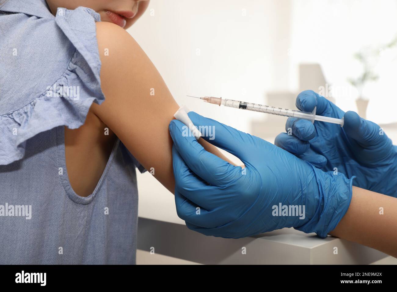 Immunization Injection Doctor giving injection to little girl in hospital, closeup ...