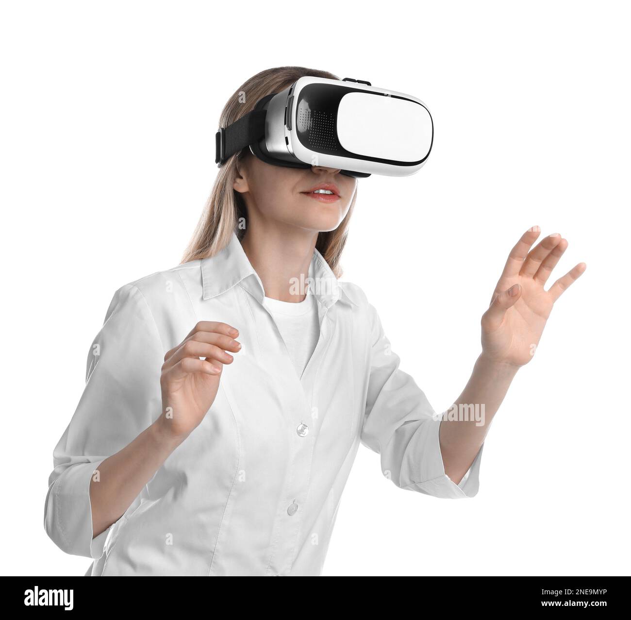 Young woman using virtual reality headset on white background Stock ...