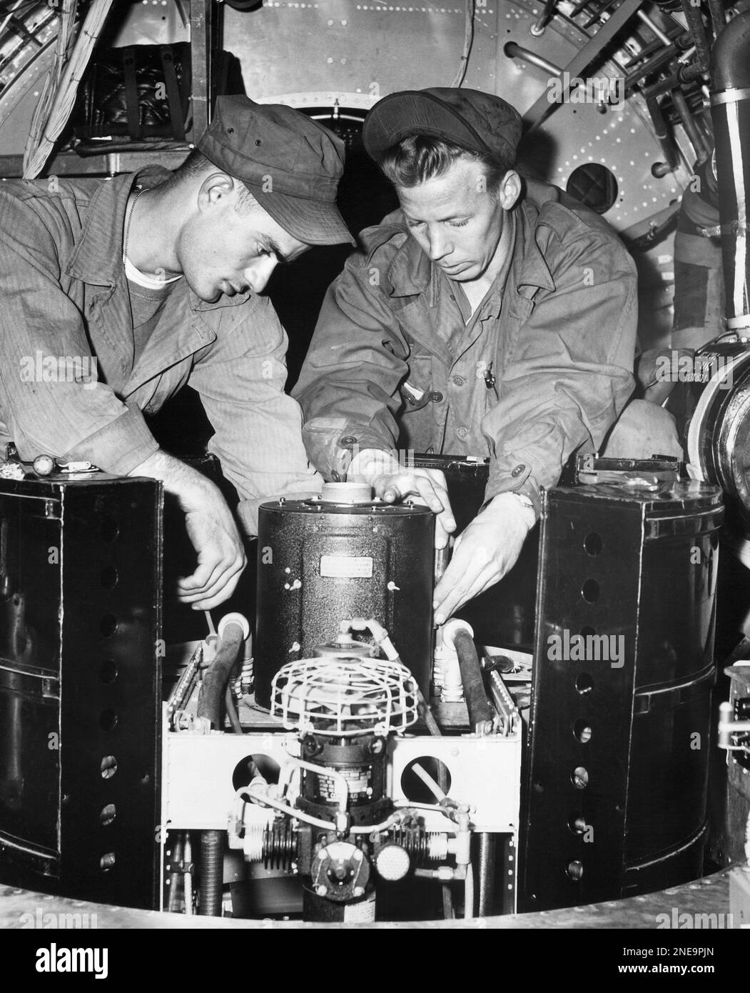 Pfc Charles Padgett (left) of Marshall, Mo., and S/Sgt Howard R