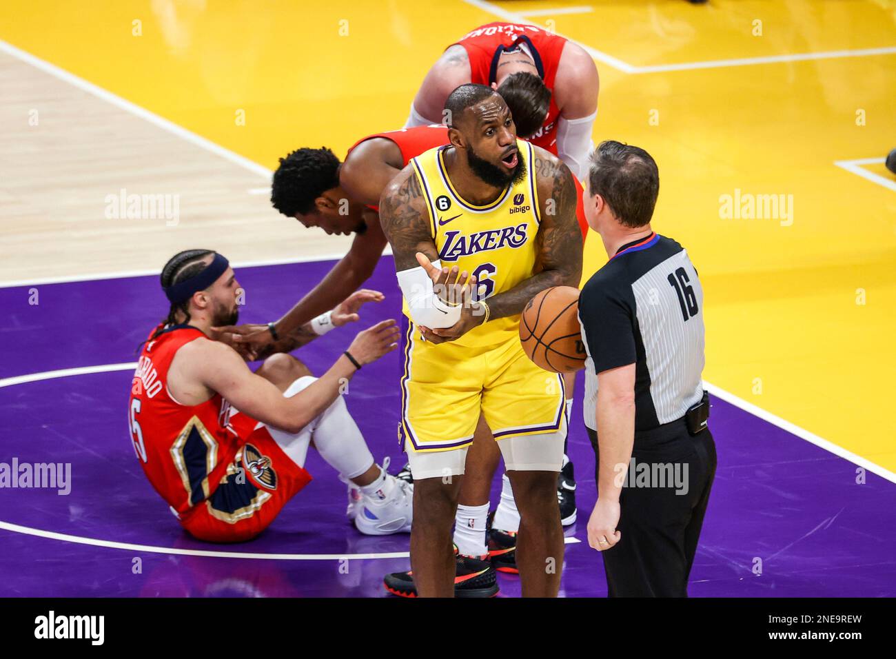 Los Angeles Lakers forward LeBron James (2nd R) argues within referee