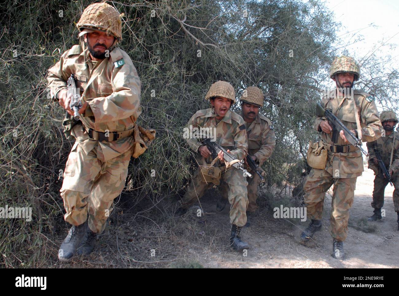 Pakistan army soldiers take part in an exercise to enhance their skills