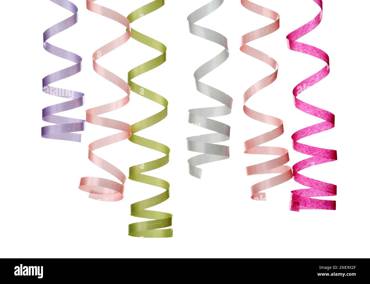 Many colorful serpentine streamers on white background Stock Photo - Alamy