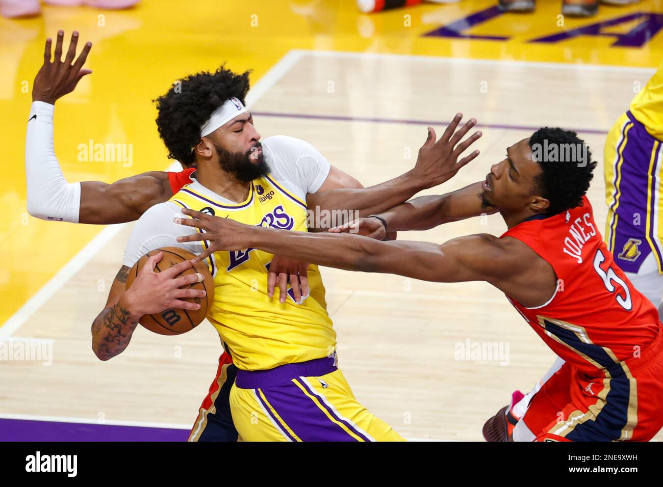 Los Angeles, United States. 15th Feb, 2023. Los Angeles Lakers forward Anthony Davis (L) and New Orleans Pelicans forward Herbert Jones (R) fight for the ball during an NBA basketball game in Los Angeles. Credit: SOPA Images Limited/Alamy Live News Stock Photo