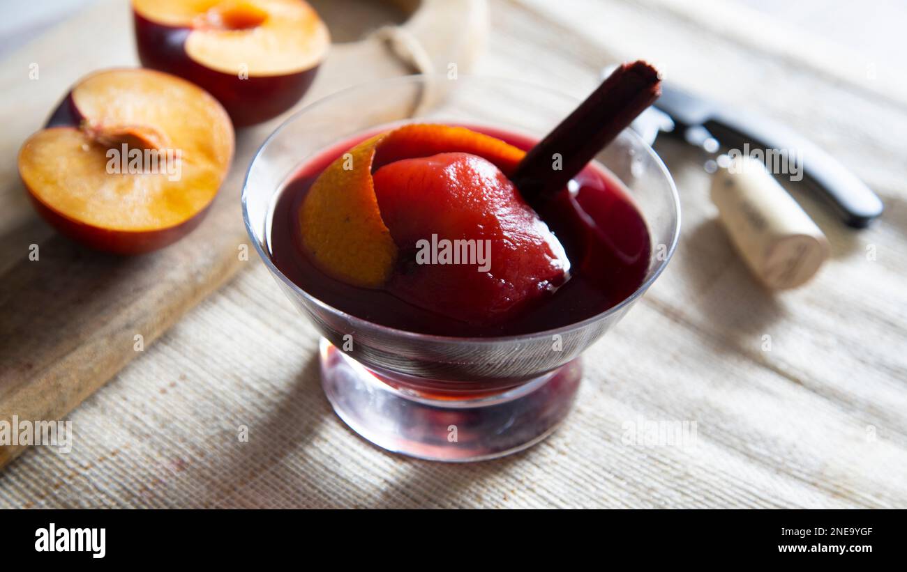 Peach cooked in red wine with cinnamon. Traditional Spanish recipe