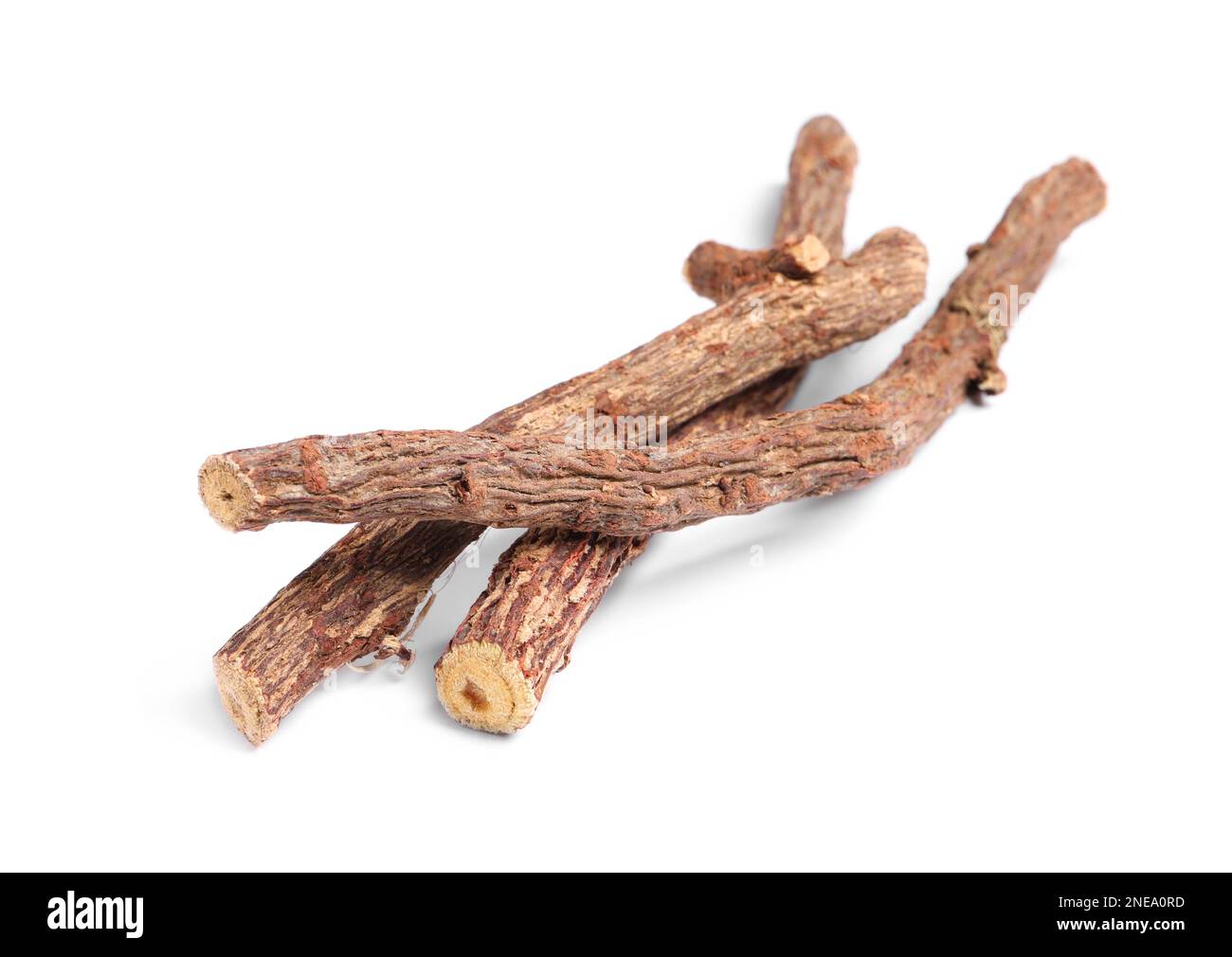Dried sticks of liquorice root on white background Stock Photo Alamy