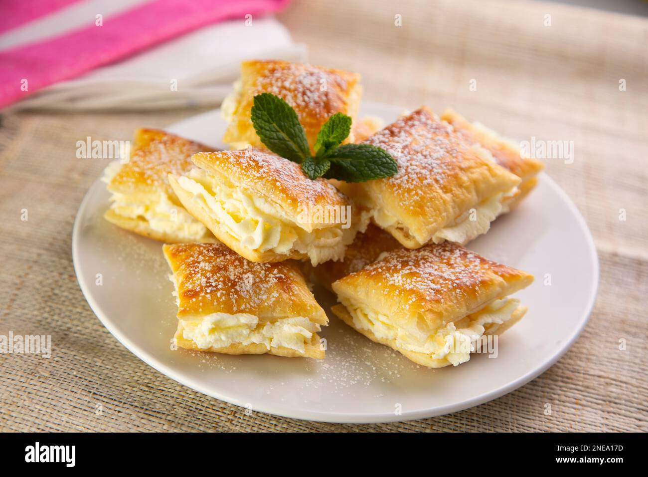 The Miguelitos de La Roda are little cakes made with puff pastry and pastry cream. Stock Photo