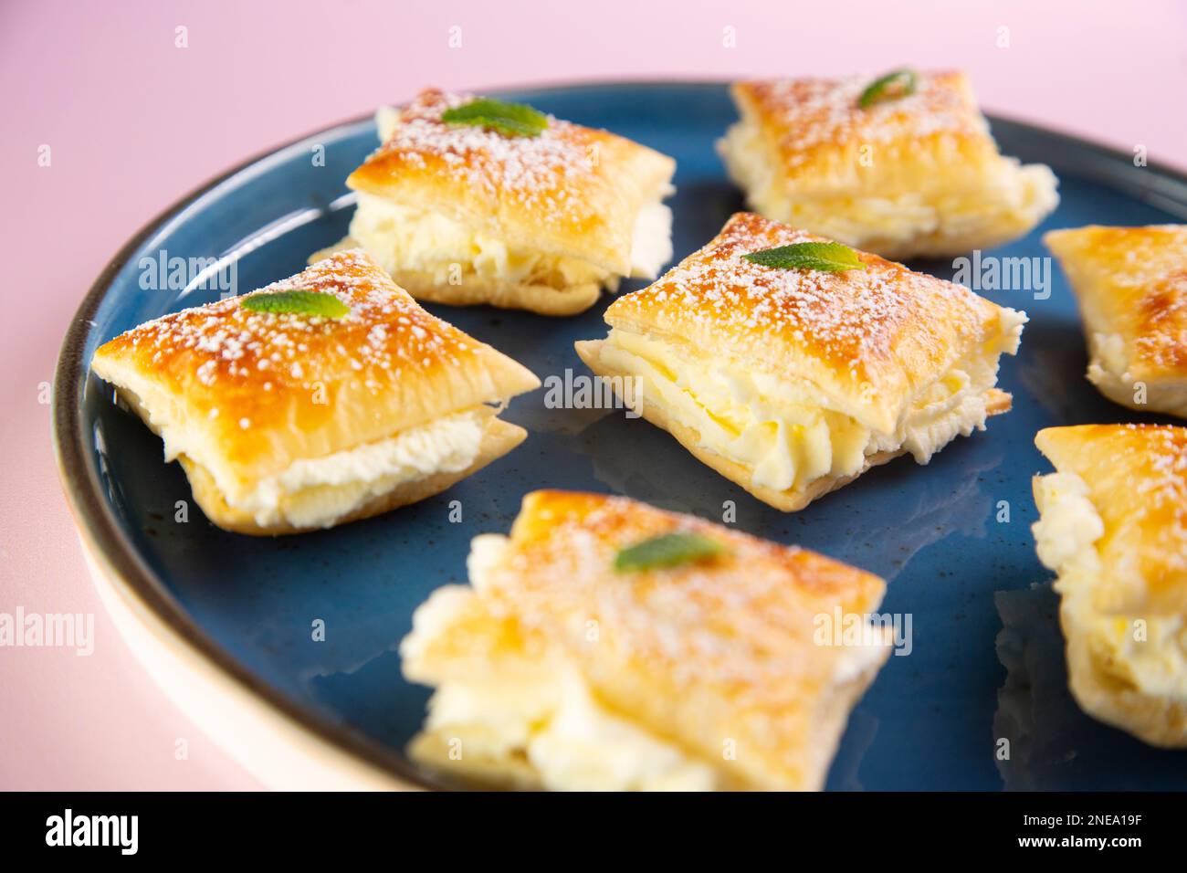 The Miguelitos de La Roda are little cakes made with puff pastry and pastry cream. Stock Photo