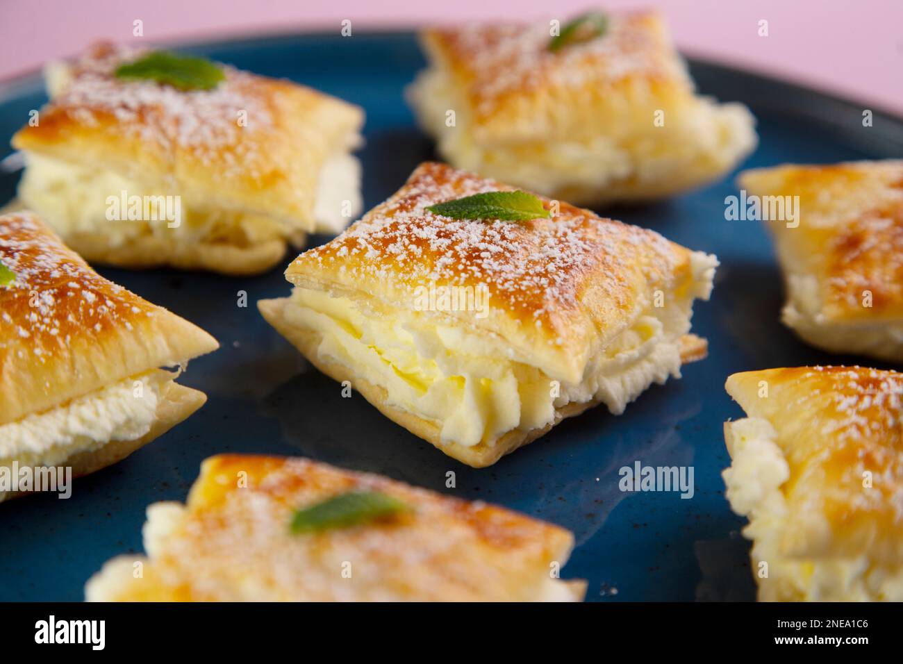 The Miguelitos de La Roda are little cakes made with puff pastry and pastry cream. Stock Photo