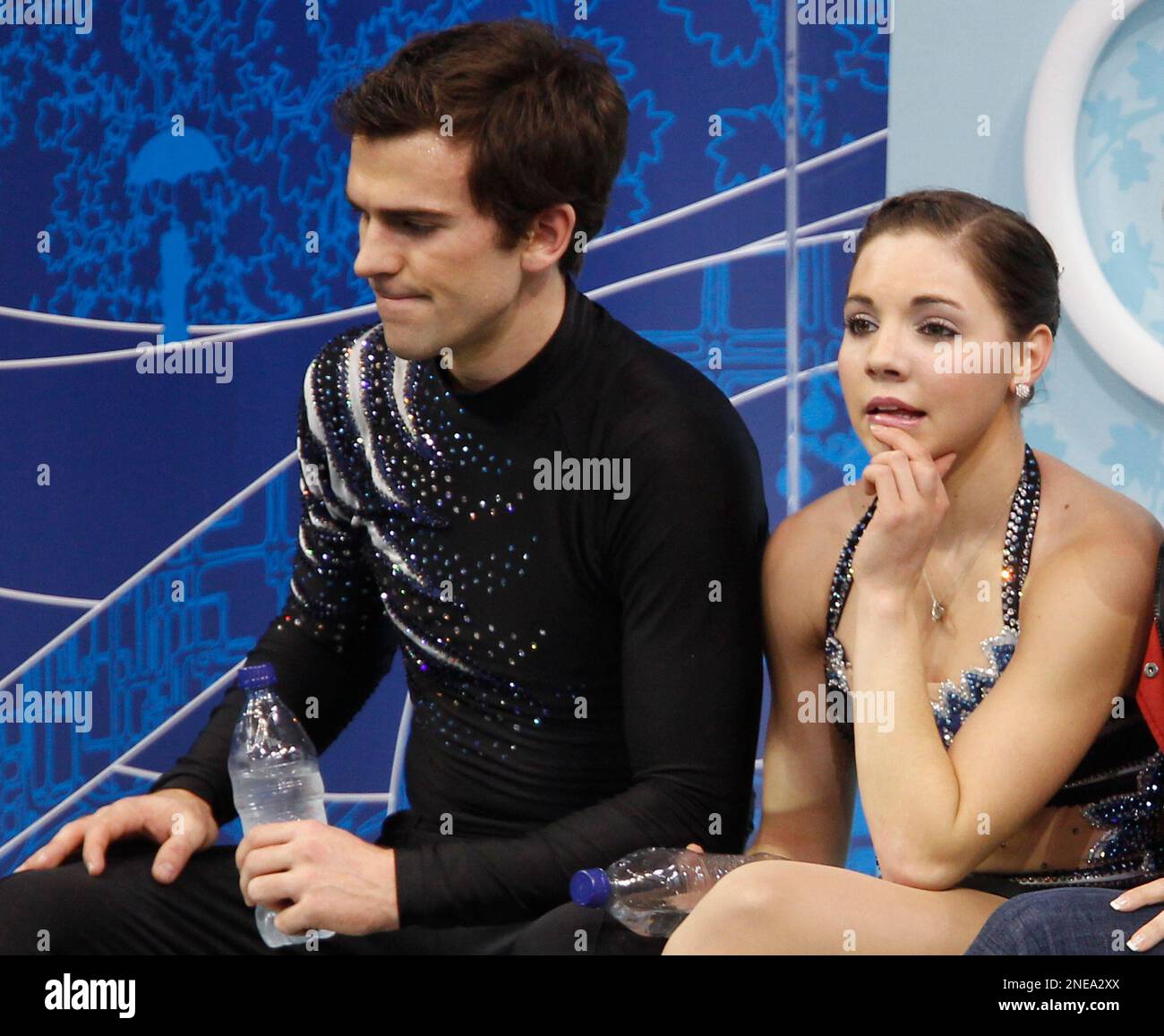 Canada's Jessica Dube and Bryce Davison sit after they performed their