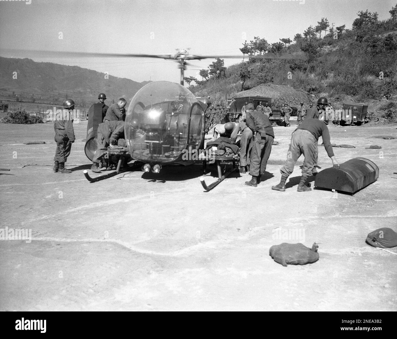 American soldiers, wounded on Korea?s Triangle Hill, are loaded on a ...