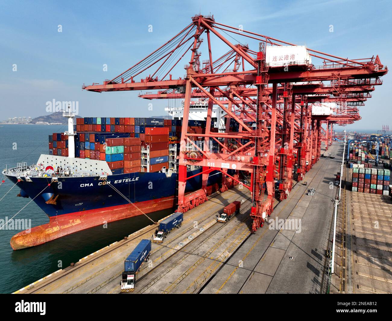 LIANYUNGANG, CHINA - FEBRUARY 16, 2023 - Cargo ships unload containers ...
